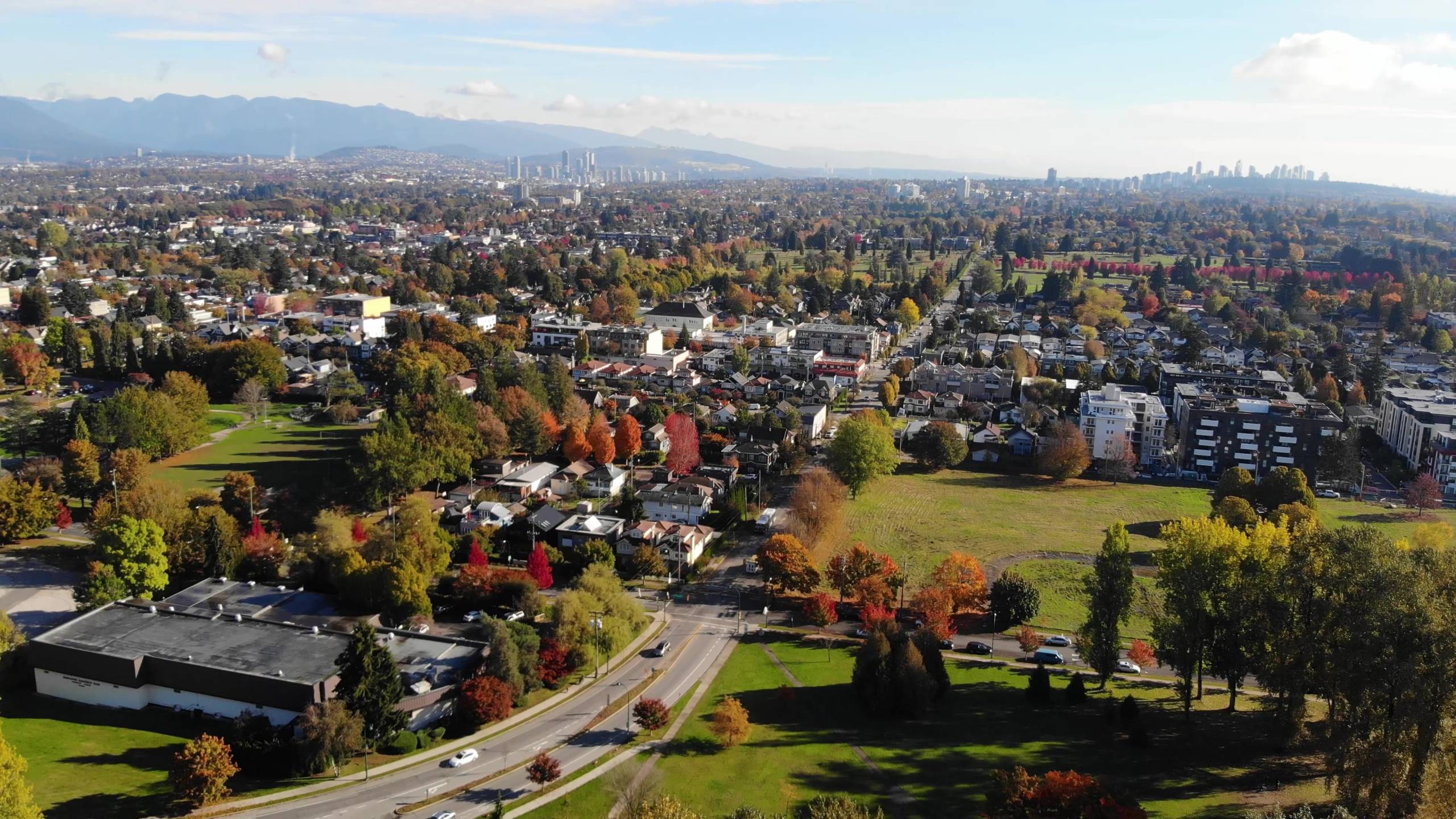 Autumn aerial of Queen Elizabeth Park Vancouver with city skyline and North Shore mountains