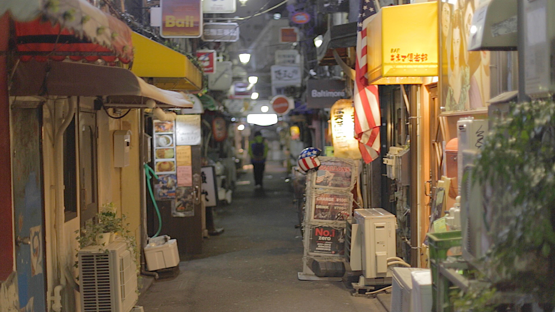 Neon-lit Tokyo alley at night